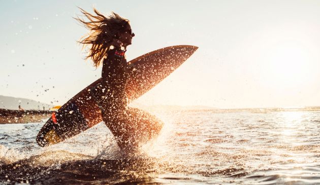 Why Surfing Is, in Many “Waves,” the Ultimate Exercise for Parents